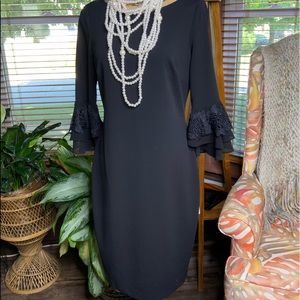Calvin Klein classic black dress with two tiered bell sleeves.